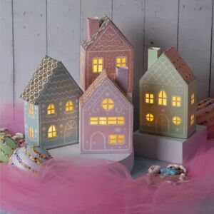 A set of 4 pinks,blue, green Light Up Gingerbread House